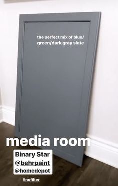 there is a sign that says media room on the wall next to a closed door