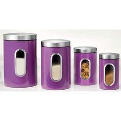 three purple canisters with food in them