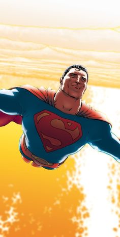 a man flying through the air while wearing a superman suit and holding his arms out