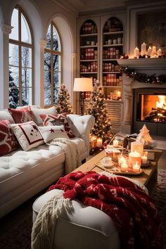 a living room filled with furniture and christmas decorations