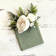 a napkin with flowers on it sitting on a table