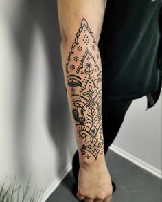 a person with a tattoo on their arm