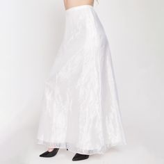 Vintage 80s floor length bridal skirt with a sheer bright white organza shell over a lining layer. Has a back zipper and hook for closure. Originally came with a matching top. Measurements and Condition: Fits like: Labeled size 8, fits modern women's small Fabric: Acetate shell/lining Brand: Unknown, made in USA Condition: Very good, with a 2" and 3" section of extremely faint pink color bleed and a tiny faint brown spot on the lining layer at the lower front left (barely visible through the sheer outer layer). Length: 41" Waist: 26.5" Hips: 38.5" - taken at the bottom of the zipper opening Shown on a 5'8" model with measurements of 35"-26"-38", usually wears a size small to medium. See our FAQ for more info on sizing and condition ratings. Bridal Maxi, Organza Bridal, Bridal Skirt, Bridal Skirts, Wedding Skirt, Top Measurements, Matching Top, Formal Wedding, Modern Woman