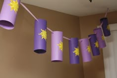 purple and yellow paper streamers hanging from the ceiling