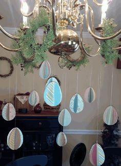 a chandelier hanging from the ceiling in a room with many decorations on it