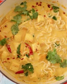 a pan filled with noodles and tofu