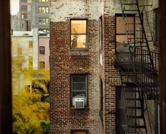 an old brick building with fire escape stairs