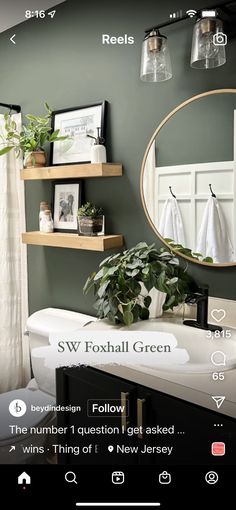 the bathroom is decorated in green and white with lots of greenery on the shelves