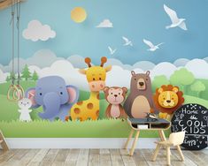 there is a wall mural with animals and birds on it in the children's room