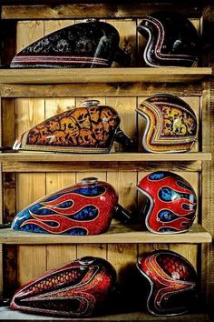 several different types of helmets are on shelves