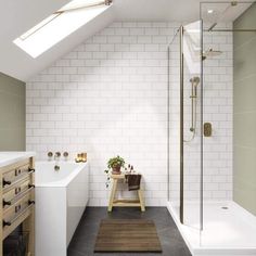 an attic bathroom with white tile and wood accents