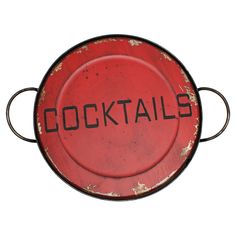 a red metal plate with the word cocktails written on it, in black ink