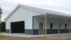 an empty building with two garages on the side