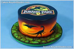 there is a dinosaur cake on the plate