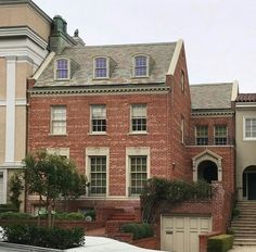 a large brick building with two story windows