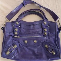 Gorgeous Soft Leather Balenciaga City Bag With Giant Silver Hardware. Preowned Condition. Beautiful Bag. No Mirror Or Dust Bag. I Can Give You A Fashionphile Dust Bag. Length: 14.75 In Width: 5 In Height: 9.5 In Drop: 5 In Sorry No Trades. Also This Is An Authentic Luxury Purse Priced Very Reasonably - Do Not Insult Me With Lowball Offers! They Will Be Not Be Accepted And You Are Wasting Everyone’s Time. Thanks. Designer Shoulder Bag With Branded Hardware For Everyday, Designer Shoulder Bag With Adjustable Strap For Errands, Designer Travel Shoulder Bag With Silver-tone Hardware, Designer Satchel With Branded Hardware For Everyday Use, Designer Shoulder Bag With Branded Hardware For Errands, Designer Shoulder Bag With Silver-tone Hardware, Designer Shoulder Bag With Silver-tone Hardware For Shopping, Luxury Purple Shoulder Bag With Adjustable Strap, Designer Purple Top Handle Shoulder Bag