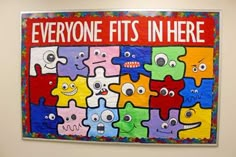 there is a poster on the wall that says everyone fits in here with colorful puzzles