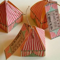 four circus tents with tags attached to them