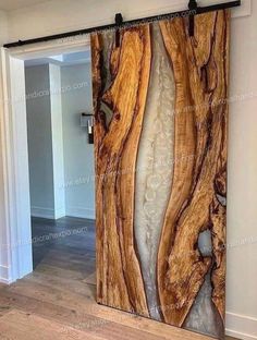 the door is made out of wood and has glass panels that look like waves on it