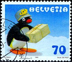 a postage stamp with a penguin holding a suitcase