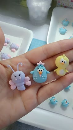 three little birds are sitting on someone's finger