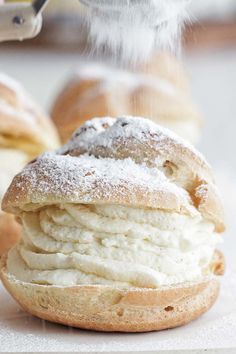 a close up of a pastry with powdered sugar on it