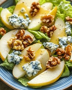 an apple salad with blue cheese and walnuts on top is served on a plate