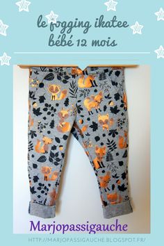 a baby's pants with foxes and leaves on it