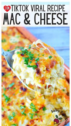 a spoon full of macaroni and cheese being lifted from a casserole dish