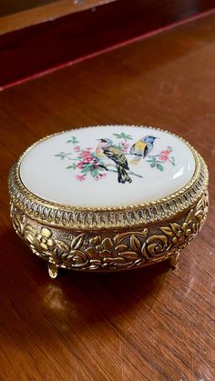 a decorative box sitting on top of a wooden table