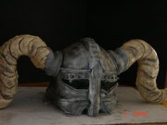 a statue of a helmet with large horns