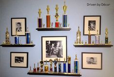 a wall with many trophies and pictures on it