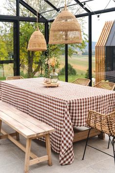 a dining room table covered with a checkered cloth