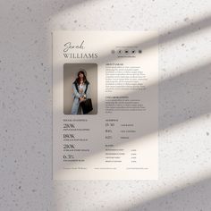 a clean and modern resume is displayed on a white background with shadows from the window