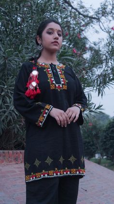 Autumn inspired  Hand crafted black khadar street wear kurta with traditional Sindhi embroidery, mirror work borders and kasuti embroidery butees.  For size guide please refer to the last few images.  The other items visible in the images would be available soon. For custom orders or if the product is sold out or you would want something bespoke, leave a message. Long Sleeve Kurta With Mirror Work For Festivals, Bohemian Style Dabka Kurta For Designer Wear, Eid Kurta With Multicolor Embroidery And Mirror Work, Straight Kurta With Resham Embroidery For Rituals, Bohemian Kurta With Mirror Work For Eid, Resham Embroidery Straight Kurta For Rituals, Ceremonial Straight Kurta With Mirror Work, Unstitched Bohemian Kurta With Mirror Work, Transitional Ceremonial Kurta With Mirror Work