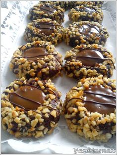 chocolate covered cookies with nuts and sprinkles