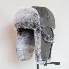 The Faux Fur Trapper Hat is an absolute choice for keeping warm during colder months. Featuring a classic trapper design, this hat has soft faux fur lining along the edges and flaps, providing extra warmth and comfort. Made with durable materials, it’s ideal for winter activities. The adjustable straps allow for a snuggly and customized fit. Key Features: Faux Fur Lining: Soft faux fur for enhanced warmth and comfort. Trapper Design: Traditional style with flaps that provide additional coverage Ushanka Hat, Russian Ushanka, Fur Trapper, Fur Trapper Hat, Russian Hat, Snow Hat, Hats Winter, Mens Fur, Travel Hat