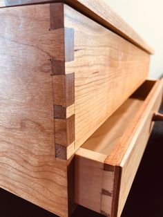 a close up of a wooden dresser drawer