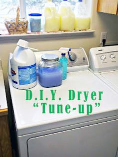 a washer and dryer sitting next to each other in front of a window