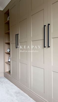 an empty room with some cabinets and shelves on the wall in front of it that says ikeapax