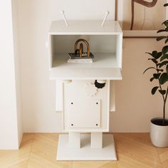 a white shelf with a clock on it next to a potted plant