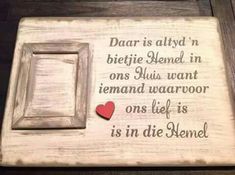 a wooden plaque with a heart on it