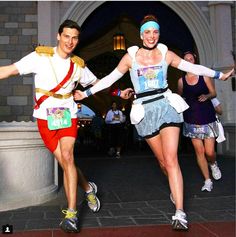 two people in costumes running on the street