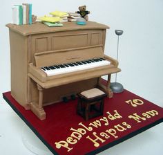 a cake that is shaped like a piano