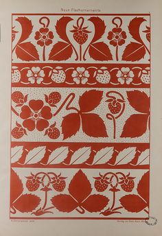 a red and white print with flowers, leaves and berries on the side of it