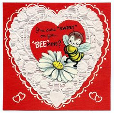 a heart shaped card with a bee on it