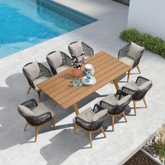 an outdoor dining table with eight chairs next to a swimming pool