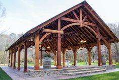 an outdoor pavilion with stone steps and pillars