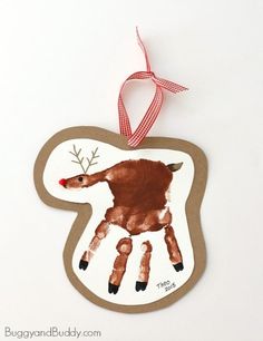 an ornament with a handprinted deer on it