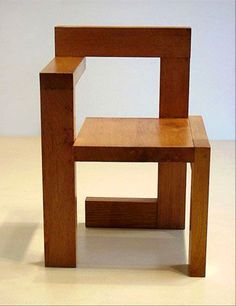 a wooden chair sitting on top of a white floor